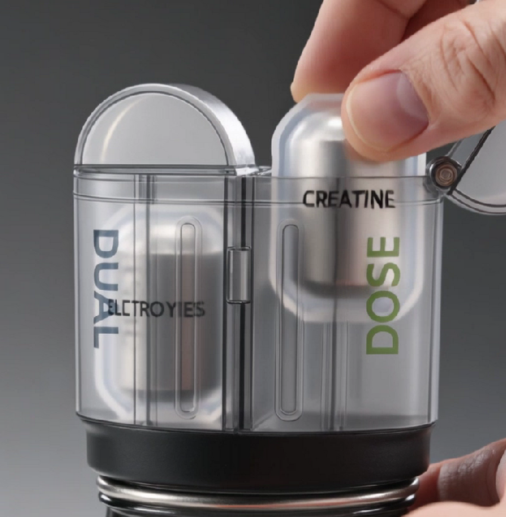 DualDose Mini twin-cartridge pod system, with a hand removing one cartridge